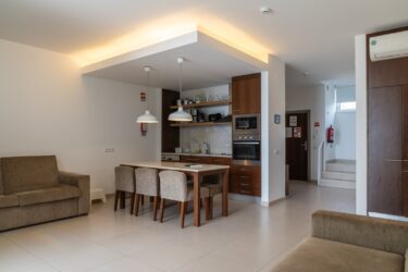 ding area with a kitchen at the self catering apartment